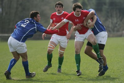 10.04.10 Wales U18 v Italy U18 - Under 18s 5 Nations Festival -  Wales' Luke Williams hands off Italy's Francesco(2) but is tackled by Timi Enodhe. 