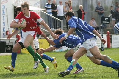10.04.10 Wales U18 v Italy U18 - Under 18s 5 Nations Festival -  Wales' Tom Prydie tries to escape the tackle of Italy's Talal Rathore. 
