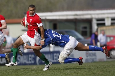 10.04.10 Wales U18 v Italy U18 - Under 18s 5 Nations Festival -  Wales' Eli Walker is caught by Italy's Timi Enodhe. 