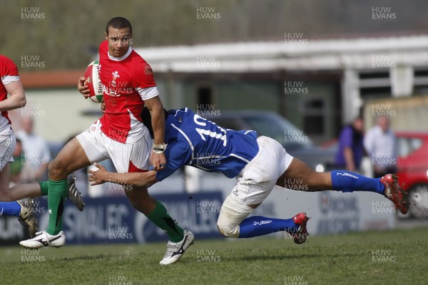 10.04.10 Wales U18 v Italy U18 - Under 18s 5 Nations Festival -  Wales' Eli Walker is caught by Italy's Timi Enodhe. 