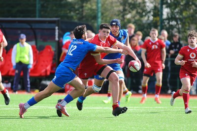 140326 - Wales U18 v Italy U18 - William Carroll of Wales is tackled by Giacomo Falchetto of Italy