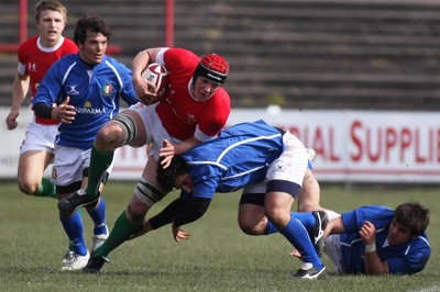 22.03.09 Wales vs. Italy. Under 18's 6 Nations. Lloyd Peers drives over the top of Alessandro Furia's attempted tackle. 
