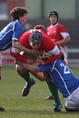 22.03.09 Wales vs. Italy. Under 18's 6 Nations. Will Taylor drives through Alberto Bonifazi(L) & Vittorio Callordi Di Vignale. 
