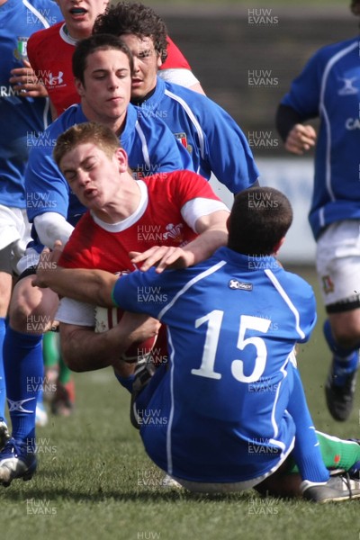 22.03.09 Wales vs. Italy. Under 18's 6 Nations. Rhodri Jones is brought to ground by the double tackle of Alessandro Tartaglia(15) & Luigi Secchi Villa. 