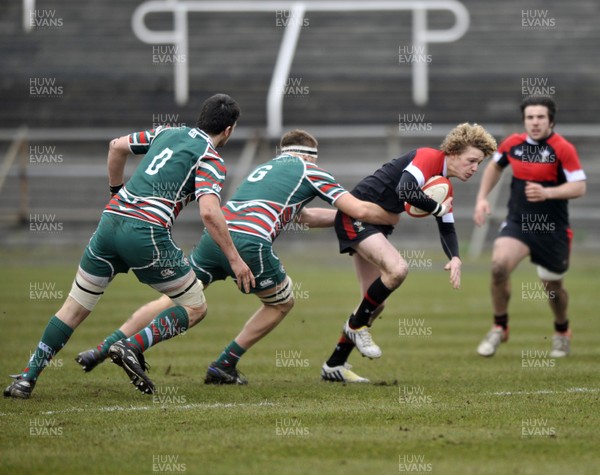 120213 - Wales U18 v Leicester Tigers Academy -   Angus O'Brien of Wales is tackled by Charlie Beckett of Leicester 