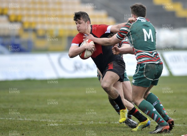 120213 - Wales U18 v Leicester Tigers Academy -   Steffan Evans of Wales is tackled by Rhys Williams and Pasqualle Dunn of Leicester Academy