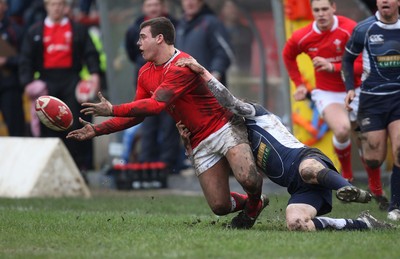 16.03.08 ..  Wales U18 v Scotland U18, Aberavon -  Wales' Rhys Jenkins makes the ball available as he is tackled 