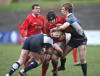 16.03.08 ..  Wales U18 v Scotland U18, Aberavon -  Wales' James Thomas is tackled by Scotlands Ross Sutherland and Alex Blair 