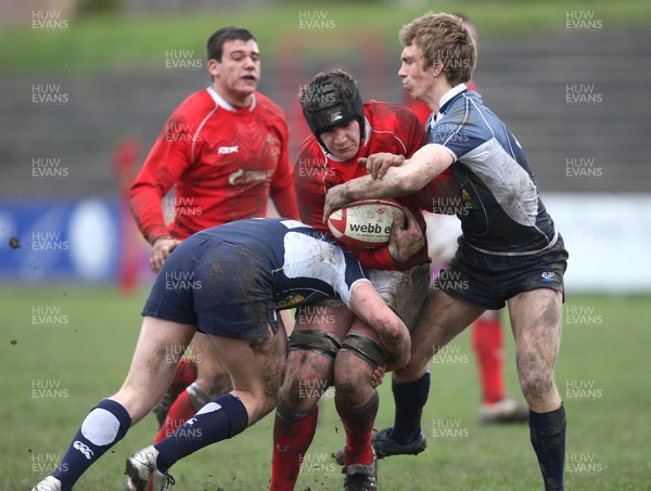 16.03.08 ..  Wales U18 v Scotland U18, Aberavon -  Wales' James Thomas is tackled by Scotlands Ross Sutherland and Alex Blair 