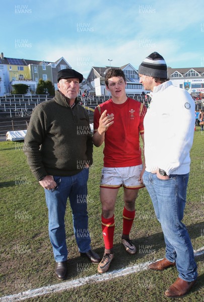 250316 - Wales U18 v Scotland U18, U18 International Series - Jim Botham of Wales with his father Liam Botham and grandfather Sir Ian Botham after he made his debut for Wales U18s against Scotland