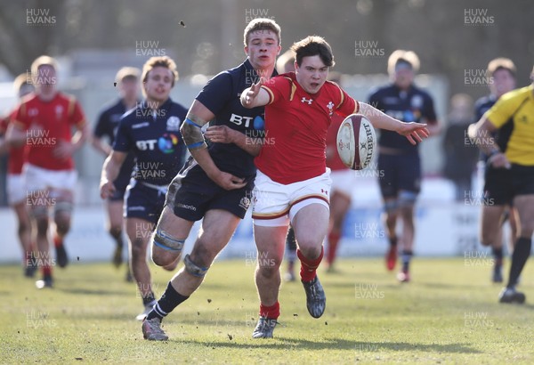 250316 - Wales U18 v Scotland U18, U18 International Series - Callum Carson of Wales and Dan Marek of Scotland compete to win the ball