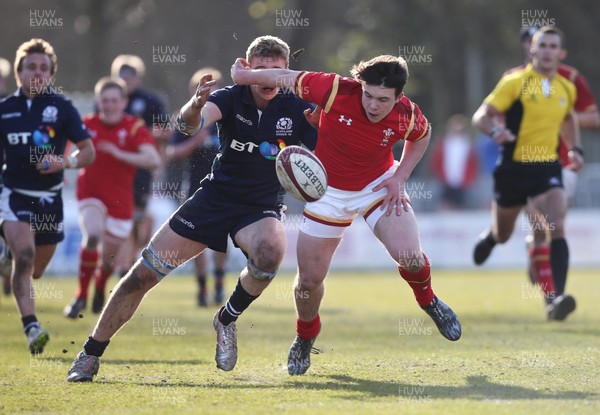 250316 - Wales U18 v Scotland U18, U18 International Series - Callum Carson of Wales and Dan Marek of Scotland compete to win the ball