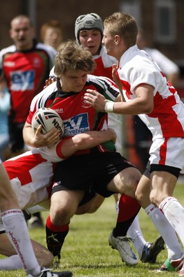 13.06.09 Wales U18's v England Lionhearts U18's The Old Parish, Maesteg -  Phil Smith is held by Ryan Hillard(L) & Ben Mullen(16). 