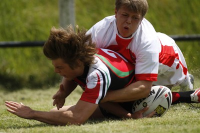 13.06.09 Wales U18's v England Lionhearts U18's The Old Parish, Maesteg -  Alex Webber is denied a try as Dom Crosby gets a hand to the ball.  