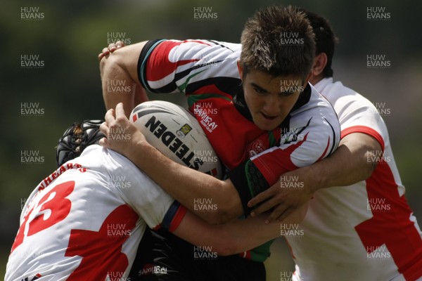 13.06.09 Wales U18's v England Lionhearts U18's The Old Parish, Maesteg -  Dale Blackmore is tackled by Kurtis Marsh(13) & Stuart Beatie. 