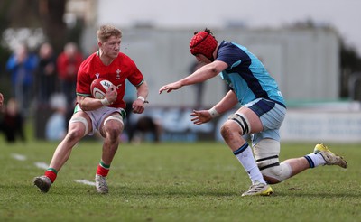 190323 - Wales U18s v Scotland U18s - Friendly - Harry Beddall of Wales is tackled by Matthew Urwin of Scotland 