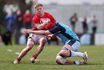 190323 - Wales U18s v Scotland U18s - Friendly - Harry Beddall of Wales is tackled by Matthew Urwin of Scotland 