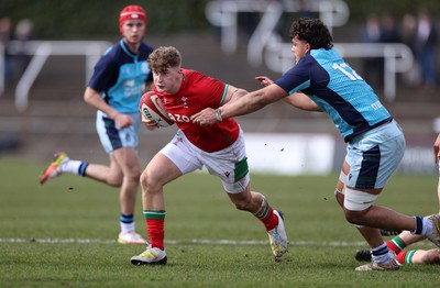 190323 - Wales U18s v Scotland U18s - Friendly - Max Fergusson of Wales is tackled by Lloyd McEwan-Peters of Scotland 