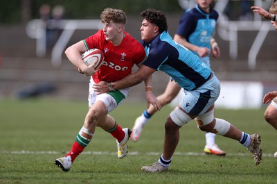 190323 - Wales U18s v Scotland U18s - Friendly - Max Fergusson of Wales is tackled by Lloyd McEwan-Peters of Scotland 