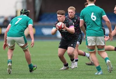 290326 - Wales U19 v Ireland U19 -Evan Hughes of Wales takes on Jon Rodgers of Ireland