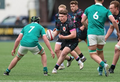 290326 - Wales U19 v Ireland U19 -Evan Hughes of Wales takes on Jon Rodgers of Ireland