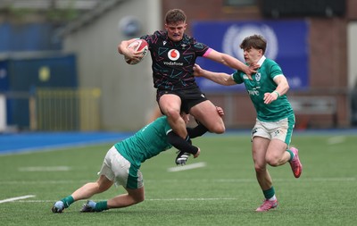 290326 - Wales U19 v Ireland U19 - Sam Morgan of Wales is tackled by Daniel O’Connell of Ireland and Ronan Kelly of Ireland
