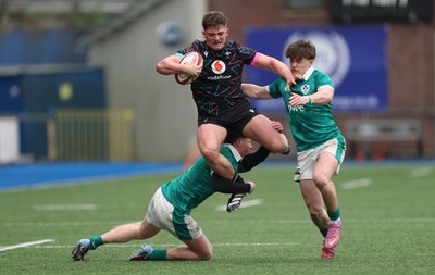 290326 - Wales U19 v Ireland U19 - Sam Morgan of Wales is tackled by Daniel O’Connell of Ireland and Ronan Kelly of Ireland