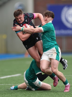 290326 - Wales U19 v Ireland U19 - Sam Morgan of Wales is tackled by Daniel O’Connell of Ireland and Ronan Kelly of Ireland