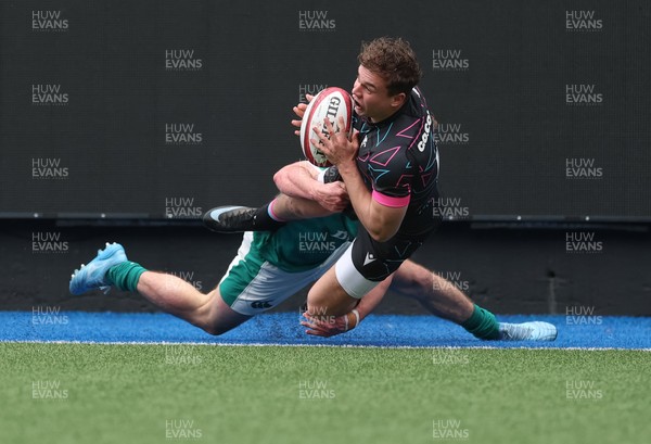 290326 - Wales U19 v Ireland U19 - Rhys Cole of Wales is tackled into touch by Fionn Rowsome of Ireland