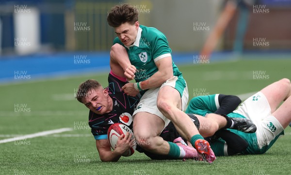 290326 - Wales U19 v Ireland U19 - Sam Morgan of Wales is tackled by Daniel O’Connell of Ireland and Ronan Kelly of Ireland