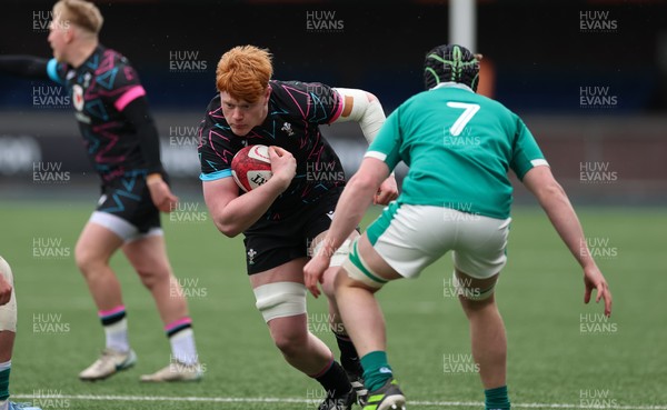290326 - Wales U19 v Ireland U19 - Sonny McCabe of Wales takes on Jon Rodgers of Ireland