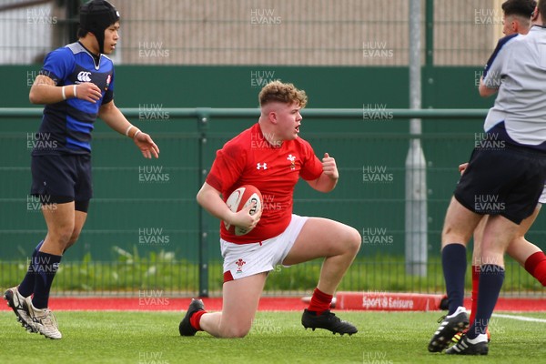 230319 - Wales U19 v Japan High Schools - Mid Season Friendly -  Brodie Coughlan of Wales scores a try 