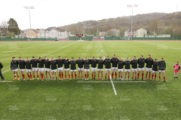 230319 - Wales U19 v Japan High Schools - Mid Season Friendly -  Players of Wales and Japan line up for the National Anthems 