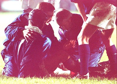 050196 - Wales Schools v Scotland Schools (Under 19s) - Peter Phillips is treated for injury in Bridgend