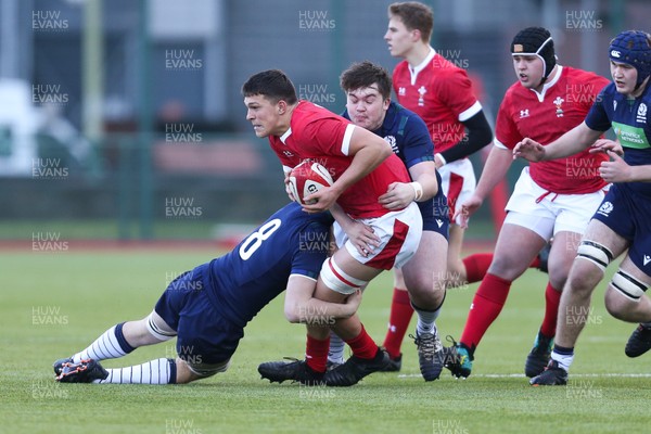 081219 - Wales U19 v Scotland U19, Age Grade International match - Teddy Williams of Wales is tackled by Rory Jackson of Scotland
