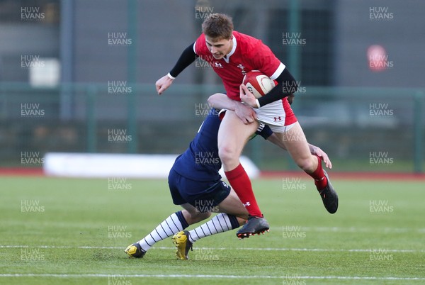 081219 - Wales U19 v Scotland U19, Age Grade International match - Jacob Beetham of Wales takes on Matthew Currie of Scotland