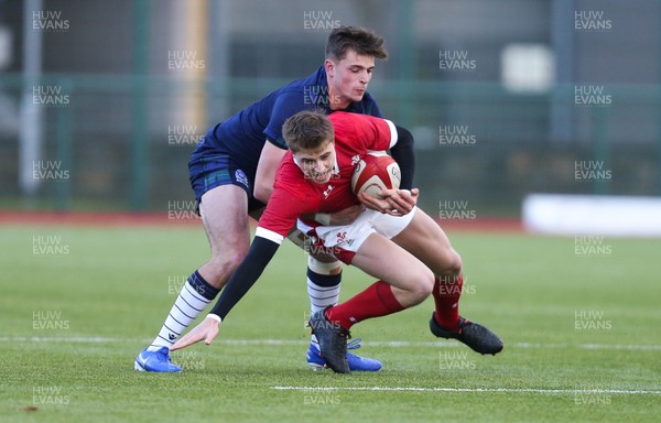 081219 - Wales U19 v Scotland U19, Age Grade International match - Jacob Beetham of Wales is held by Scott King of Scotland