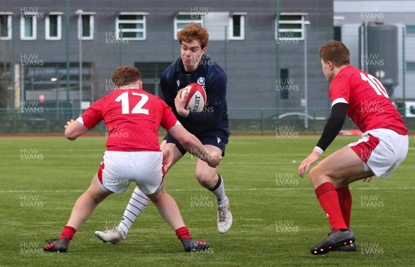 081219 - Wales U19 v Scotland U19, Age Grade International match - Harry Mercer of Scotland is tackled by Aneurin Owen of Wales