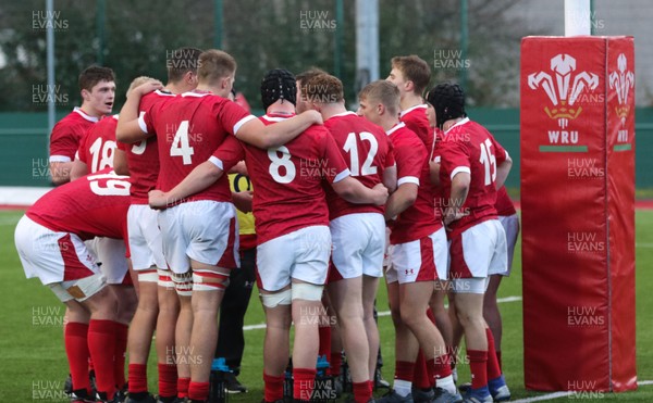 081219 - Wales U19 v Scotland U19, Age Grade International match - The Wales team huddle together during a break in play