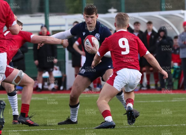 081219 - Wales U19 v Scotland U19, Age Grade International match - Tom Lanni of Scotland takes on Ethan Lloyd of Wales
