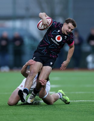 191225 - Wales U19s v England U19s - International Friendly - Rhys Cole of Wales is tackled by Ollie Batson of England 