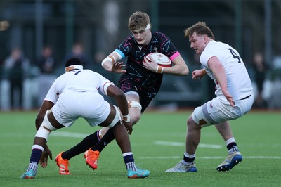 191225 - Wales U19s v England U19s - International Friendly - Osian Williams of Wales is tackled by Tate Williams of England 