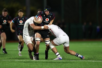 191225 - Wales U19s v England U19s - International Friendly - Gabe Williams of Wales is tackled by Victor Worsnip of England 