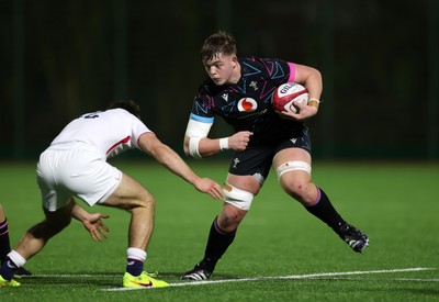 191225 - Wales U19s v England U19s - International Friendly - Cerrig Smith of Wales is tackled by Ollie Batson of England 