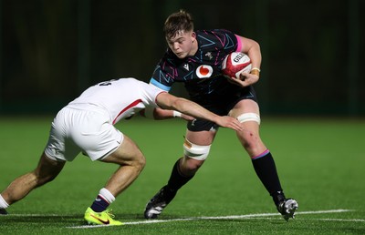 191225 - Wales U19s v England U19s - International Friendly - Cerrig Smith of Wales is tackled by Ollie Batson of England 