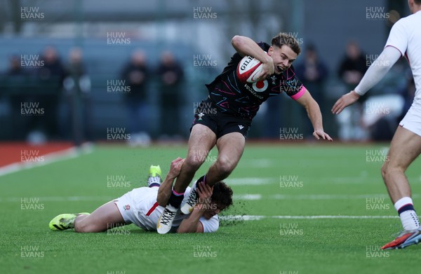 191225 - Wales U19s v England U19s - International Friendly - Rhys Cole of Wales is tackled by Ollie Batson of England 