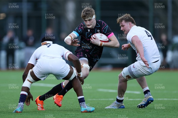 191225 - Wales U19s v England U19s - International Friendly - Osian Williams of Wales is tackled by Tate Williams of England 