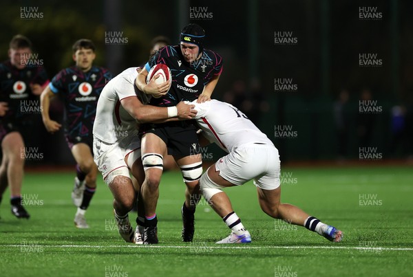 191225 - Wales U19s v England U19s - International Friendly - Gabe Williams of Wales is tackled by Victor Worsnip of England 
