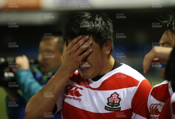 270319 - Wales U19s v Japan High Schools - International Friendly - Japan players let the emotions out after their loss to Wales 