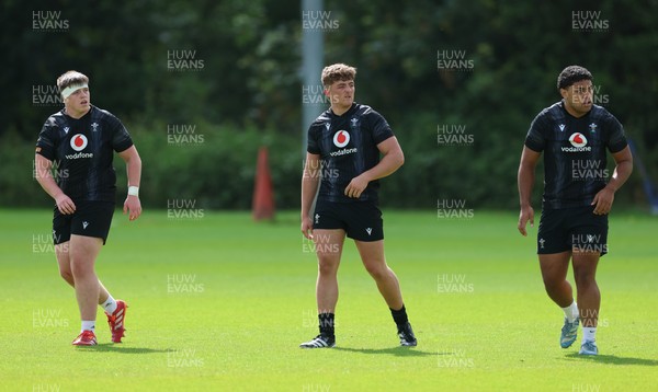 090626 - Wales U20 Rugby Training - Dylan James, Sam Morgan and James Talamai during a training session ahead of the U20 World Cup in Georgia